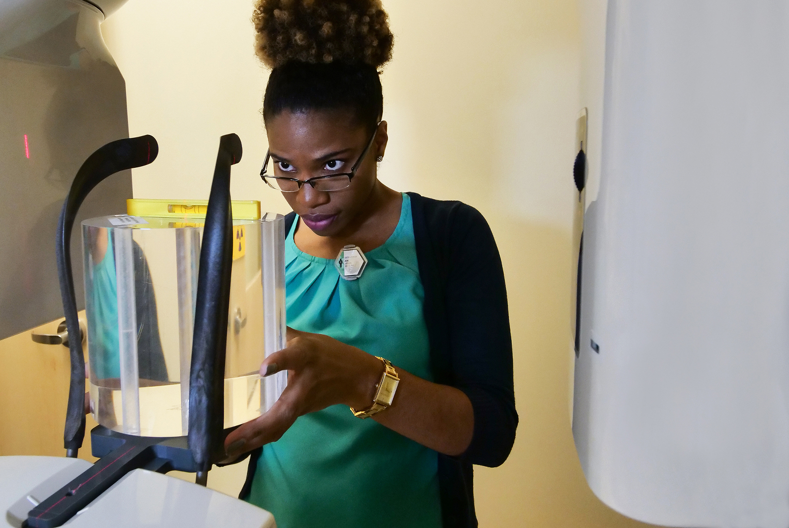 Nuclear physicist works on an MRI device.
