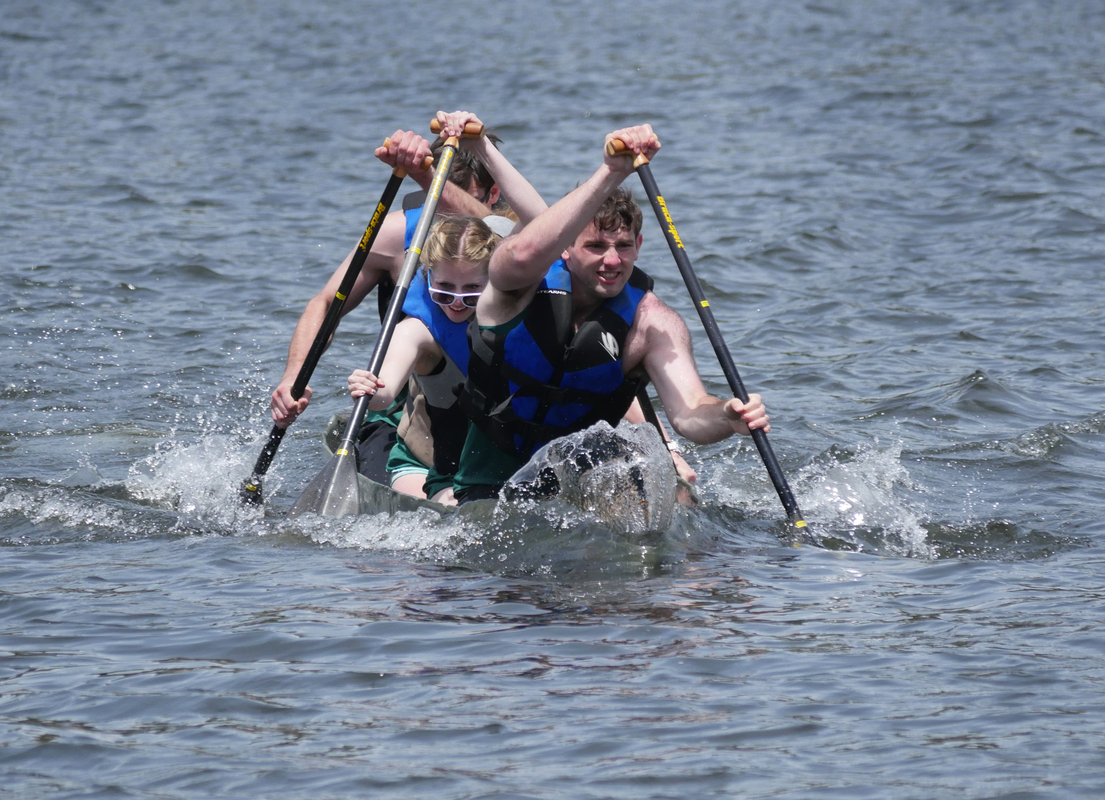 Paddling a concrete canoe on Evergreen Lake, Colorado