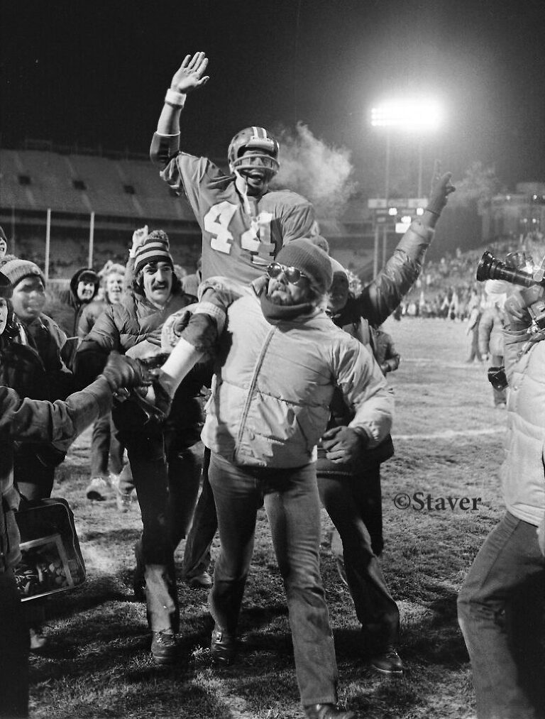 Fans and Floyd Little celebrate at end of his last home game.